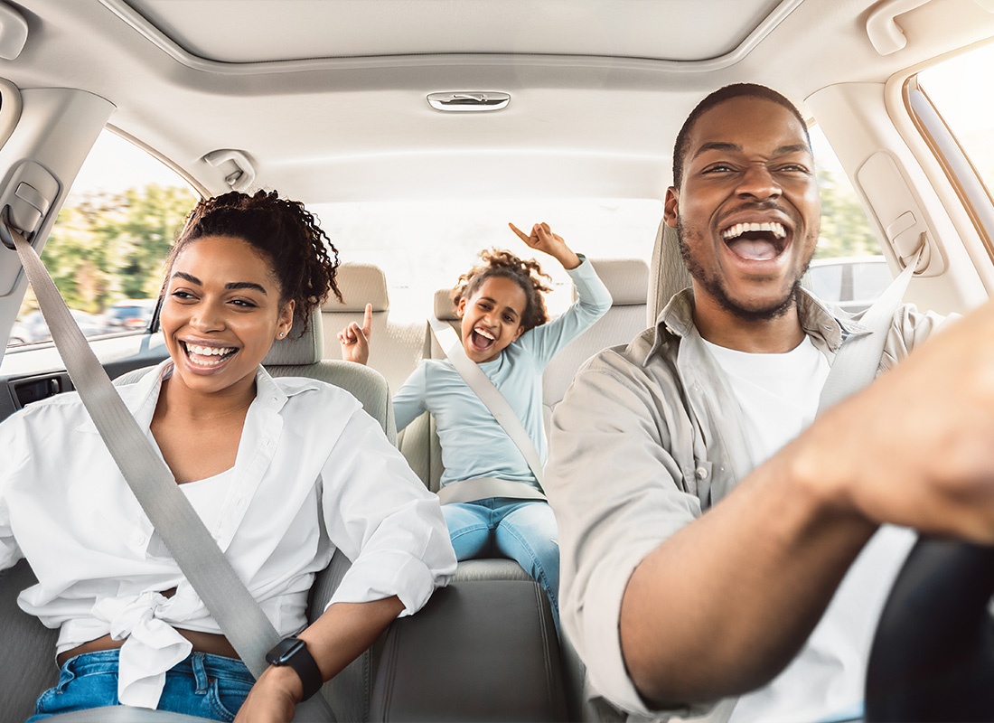 Personal Insurance - Young Family Having Fun Together While Taking a Rise in Their Car